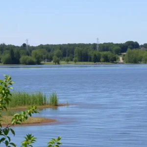 View of Onondaga Lake showing discolored water and recreational activities