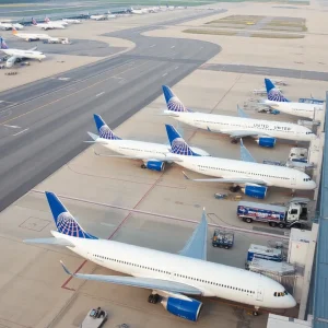 United Airlines planes at a crowded airport terminal