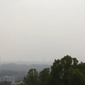 City skyline under hazy conditions caused by wildfire smoke