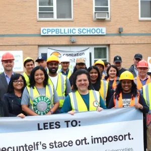 Local leaders advocating for project labor agreements at a public school event.