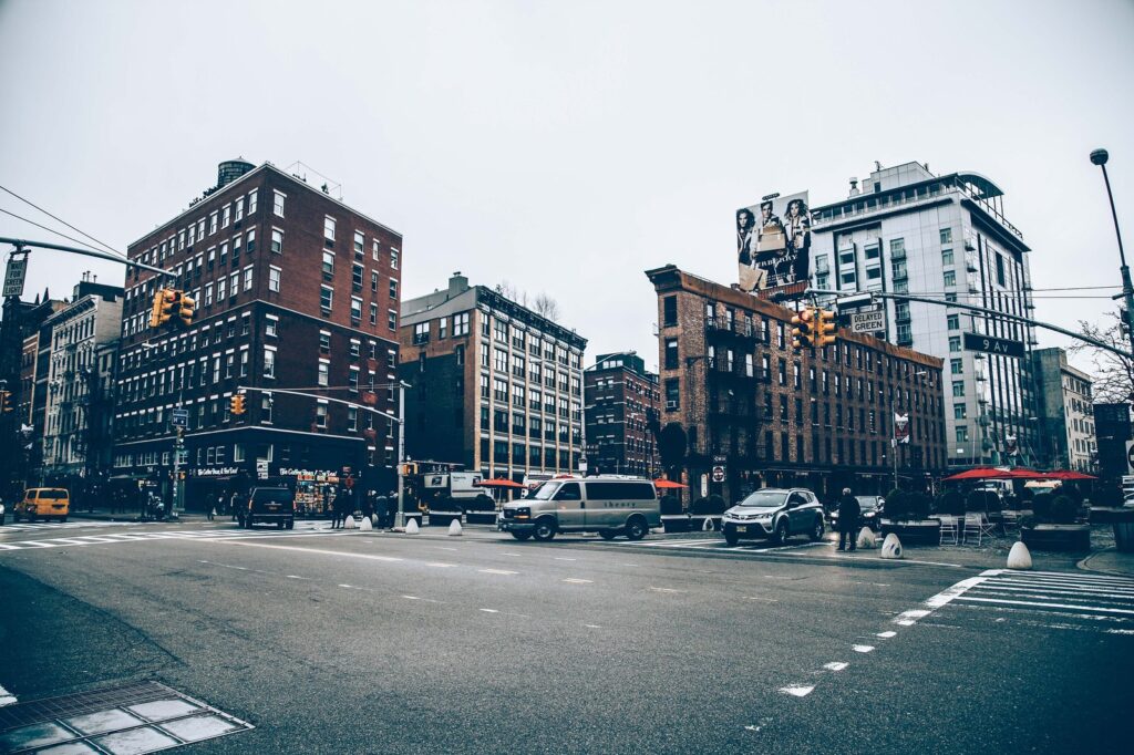 Quiet urban intersection lined with brick buildings